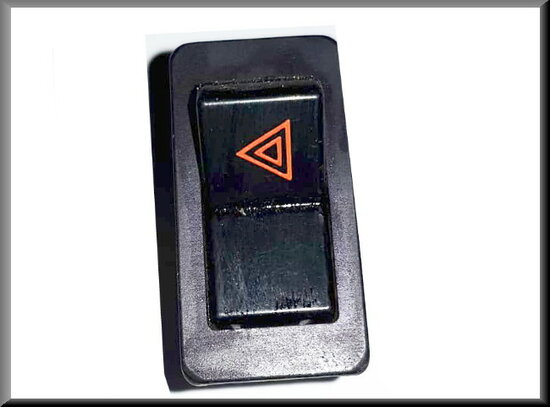 Switch warning light with chrome frame (logo in red, triangle to the left).